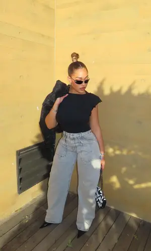 Jordyn Woods’ Outfit in The Attico Pants, Chanel Eyewear & Hermes Jewelry (2024)