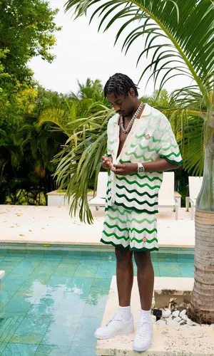 Lil Tjay wearing Casablanca shorts