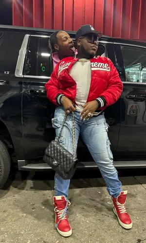 Saucy Santana’s Outfit in Supreme Jacket, Rick Owens Eyewear & New Era Cap (2024)