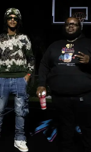 Skilla Baby wearing Louis Vuitton hat