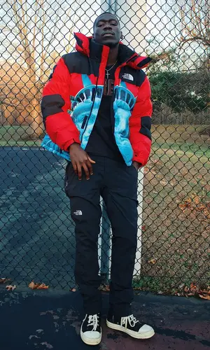 Foggieraw wearing The North Face pants