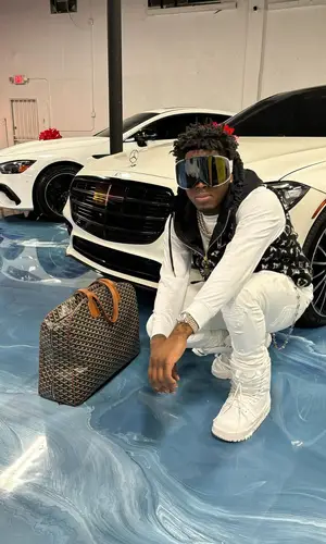 Real Boston Richey’s Outfit in Amiri Jeans, Goyard Bag & Louis Vuitton Eyewear (2024)