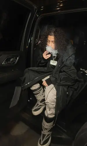 DD Osama wearing Moncler boots