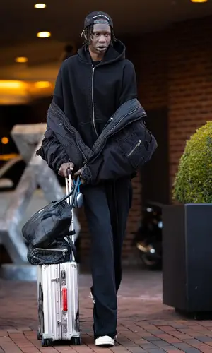 Bol Bol’s Outfit in Balenciaga Jacket, Rimowa Bag & Chrome Hearts Cap (2024)