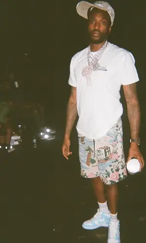 Meek Mill’s Outfit in Amiri Shorts, Readymade Cap & Denim Tears (2024)