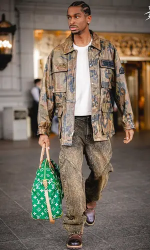 Shai’s Outfit in Fubu Jacket, Timberland Boots & Louis Vuitton Bag (2024)