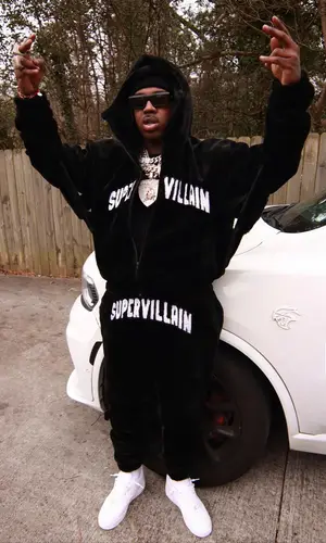 EST Gee’s Outfit in Supervillain Hoodie, Nike Sneakers & Celine Eyewear (2024)