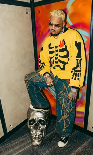 Chris Brown’s Outfit in Loverboy by Charles Jeffrey Sweater, Drop Dead Jeans & Rick Owens Sneakers (2024)