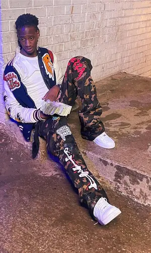 Yung Mal’s Outfit in Ricchezza Forever Jacket & Nike Sneakers (2024)