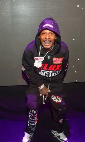Sauce Walka wearing Louis Vuitton sneakers