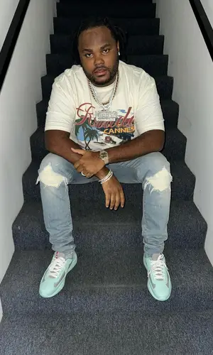 Tee Grizzley’s Outfit in Rhude T-Shirt, Amiri Jeans & Prada Sneakers (2024)