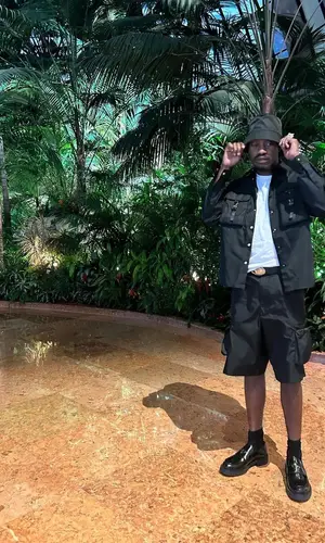 Lil Tjay wearing Prada boots
