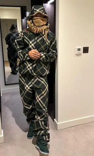 Central Cee wearing Burberry scarf