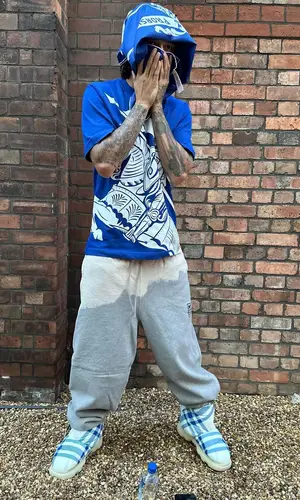 Central Cee wearing Burberry boots