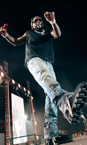 Burna Boy wearing Gucci jeans