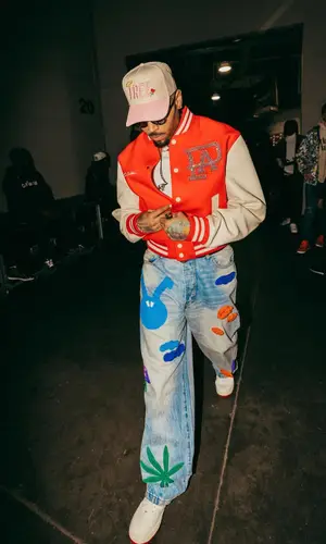Chris Brown’s Outfit in Louis Vuitton Jacket, Burberry T-Shirt & Pheit Cap (2024)