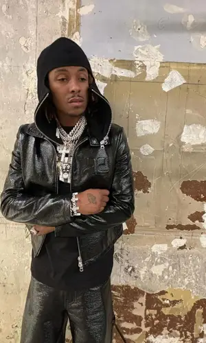 Rich The Kid wearing Chrome Hearts hat