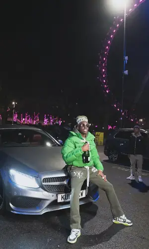 Bobby Shmurda’s Outfit in Tobe Footwear Sneakers & Fullypaid Hat (2024)