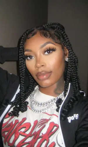 Asian Doll wearing Palm Angels jacket