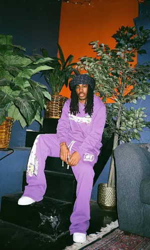 Eem Triplin wearing Famine pants