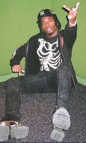 Playboi Carti wearing Saint Laurent sweater