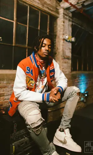 Playboi Carti wearing Supreme scarf