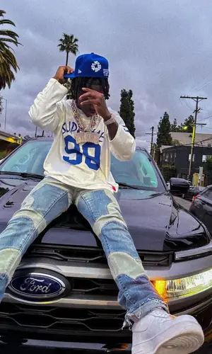 2Rare’s Outfit in Supreme Top, New Era Cap & Denim Tears (2024)