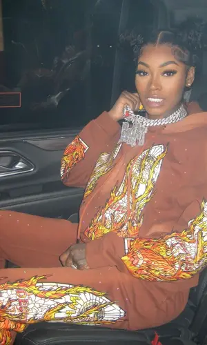 Asian Doll’s Outfit in Who Decides War Hoodie & Nike Sneakers (2024)