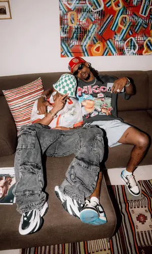 Yhemolee wearing Supreme cap