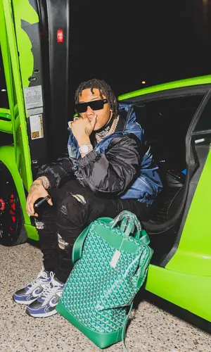 Lil Migo wearing Goyard backpack