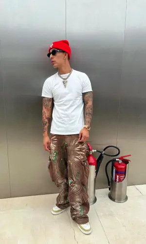 Rvssian’s Outfit in Louis Vuitton Sneakers, Prada Eyewear & Chrome Hearts Cap (2024)