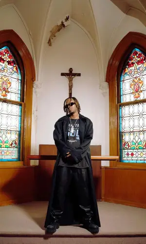 Rich The Kid wearing Louis Vuitton bag