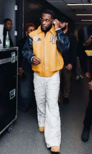 Burna Boy wearing Pelle Pelle jacket