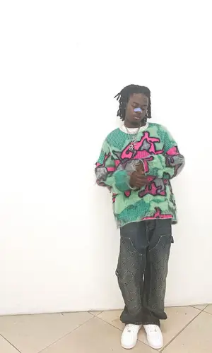 Wolfacejoeyy wearing Nike sneakers