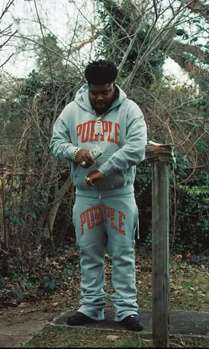 BossMan Dlow wearing Nike sneakers