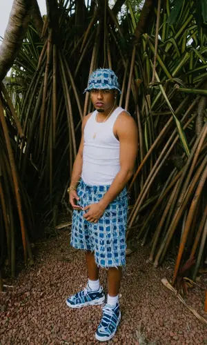 Myke Towers’ Outfit in Nike Sneakers & Supreme Hat (2024)