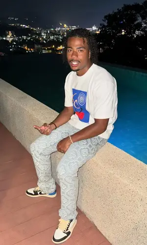Gambi wearing Casablanca jeans