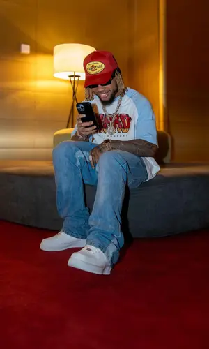 Poco Lee’s Outfit in Nike Sneakers, Dolce & Gabbana Eyewear & Monostarz Cap (2024)