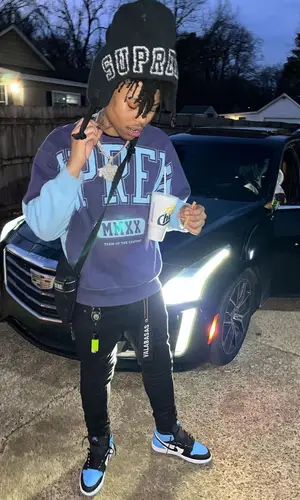Hopout Shawn wearing Supreme bag