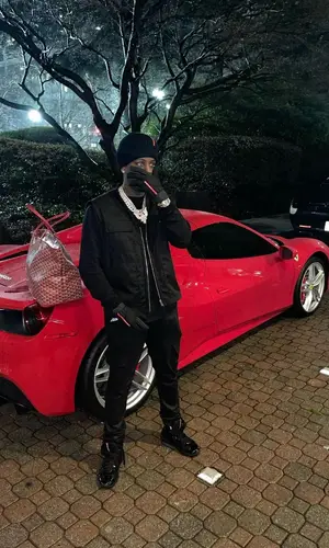 Real Boston Richey’s Outfit in Goyard Bag & Prada Hat (2024)
