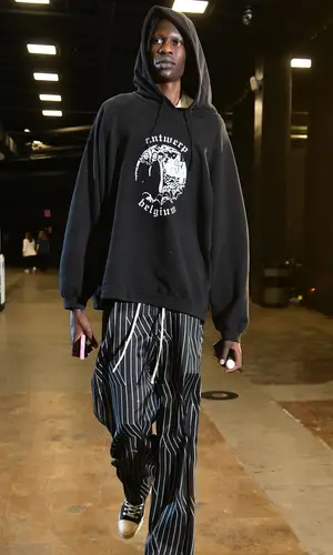 Bol Bol’s Outfit in Raf Simons Hoodie, Rick Owens Trousers & Converse Sneakers (2024)