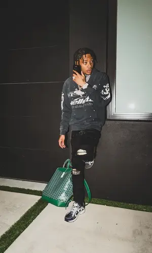 Lil Migo wearing Goyard backpack