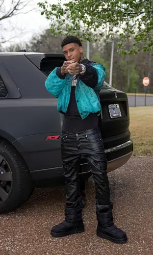 NLE Choppa wearing Louis Vuitton boots