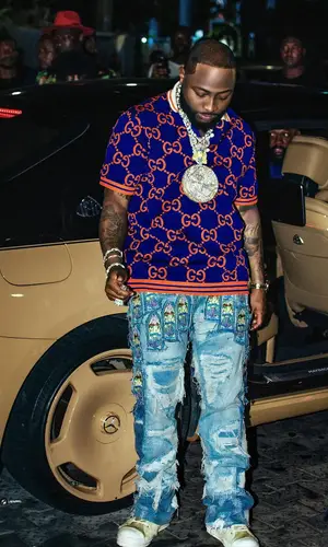 Davido’s Outfit in Gucci Shirt, Who Decides War Jeans & Rick Owens Sneakers (2024)