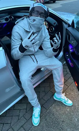 J1mulla wearing Nike glov