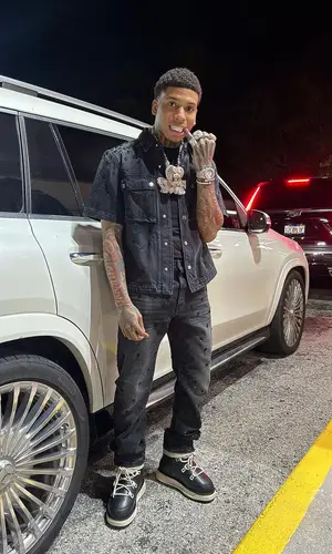 NLE Choppa wearing Amiri shirt