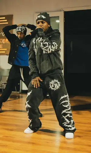 Jacquees’ Outfit in Frozen Roses Hoodie & Nike Sneakers (2024)