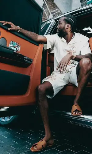 Meek Mill’s Outfit in Prada Shirt, Audemars Piguet Watch & Hermes Sandals (2024)