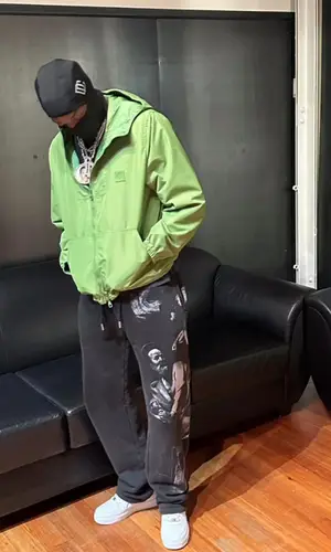 Meek Mill’s Outfit in Louis Vuitton Jacket, Off-White Pants & Nike Sneakers (2024)