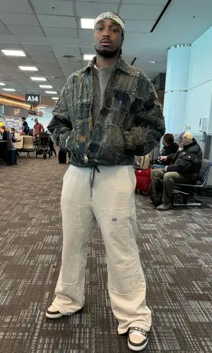 Quavo wearing Louis Vuitton bag